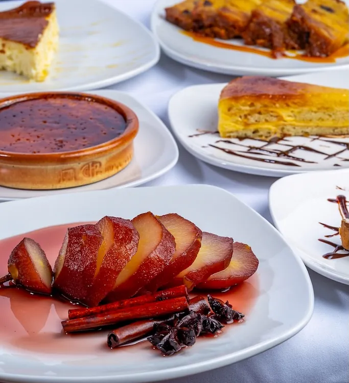 A spread of Spanish desserts — flan, tarta and peras al vino at Los Gallegos Miami